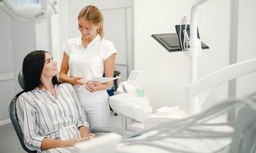 Woman sitting in dental chair